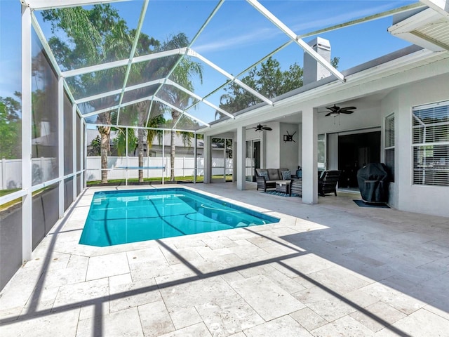 view of swimming pool featuring a fenced in pool, a patio area, fence, a ceiling fan, and an outdoor living space