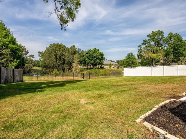 view of yard featuring fence