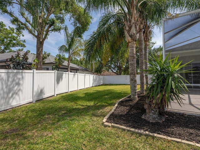 view of yard with a fenced backyard