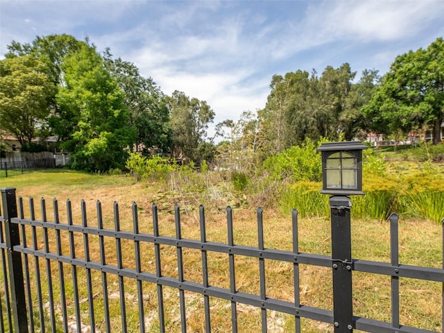 view of gate with fence