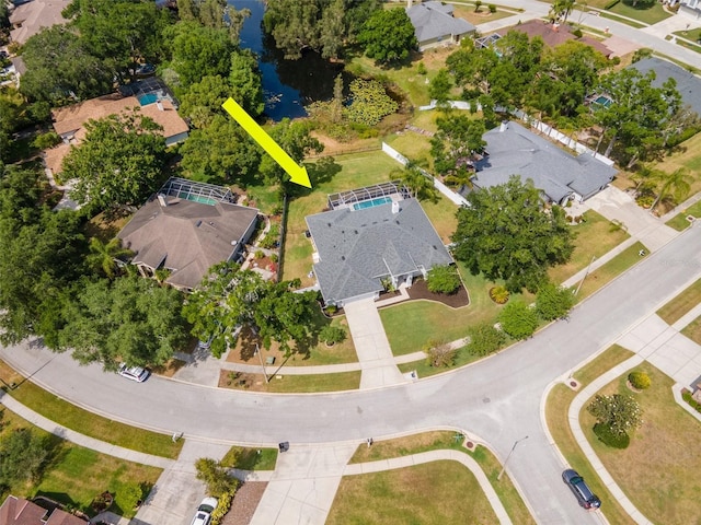 birds eye view of property with a water view