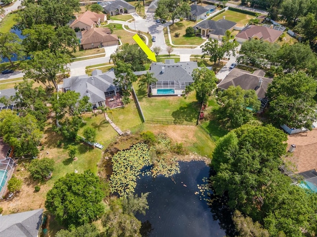 drone / aerial view featuring a water view and a residential view