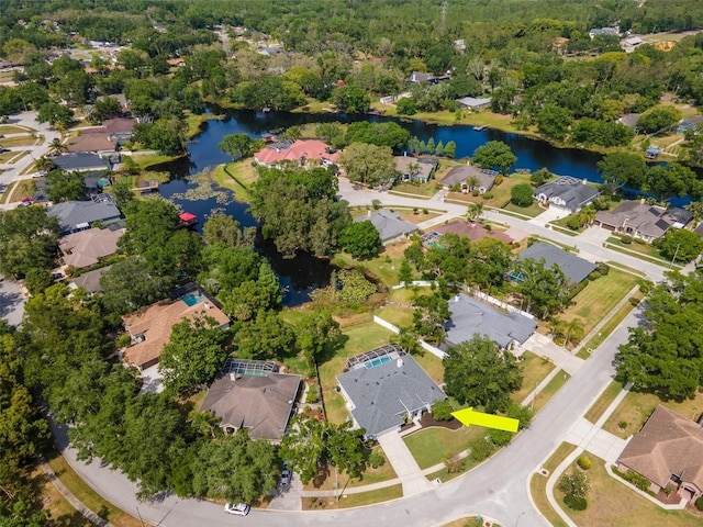 bird's eye view featuring a residential view and a water view