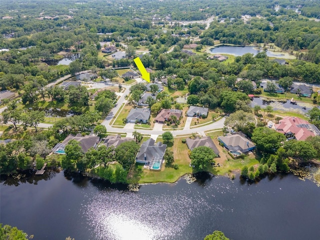 birds eye view of property with a residential view and a water view