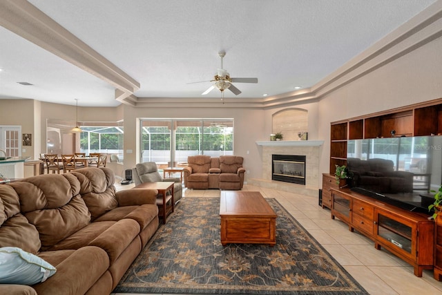 4022 Valrico Grove Dr, Valrico, FL 33594 - living room with light tile patterned flooring, ceiling fan, and a tiled fireplace