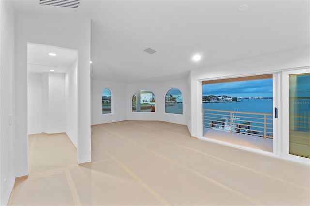 empty room with recessed lighting and visible vents