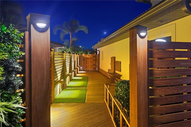 property exterior at twilight featuring stucco siding