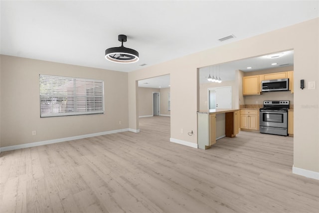 unfurnished living room with baseboards, visible vents, light wood-style floors, and recessed lighting