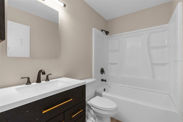 bathroom with toilet, vanity, and  shower combination