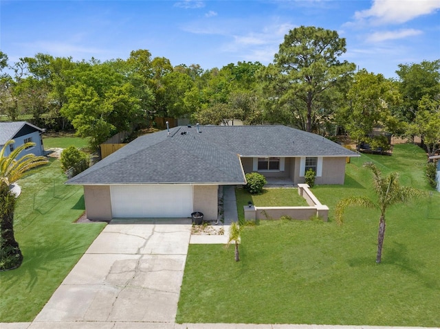 single story home featuring concrete driveway, roof with shingles, a front yard, an attached garage, and stucco siding