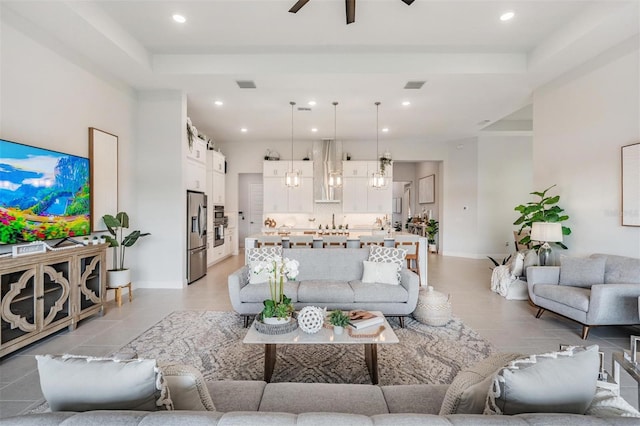 living room with light tile patterned flooring, recessed lighting, a ceiling fan, and visible vents
