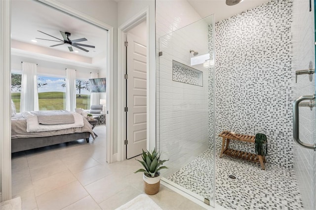 full bathroom with tile patterned floors, a ceiling fan, ensuite bath, and tiled shower