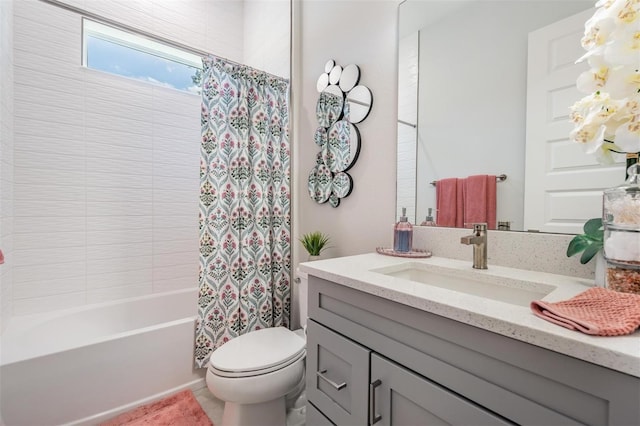 full bathroom featuring vanity, toilet, and shower / tub combo with curtain