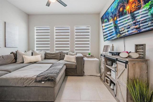bedroom with light tile patterned floors, ceiling fan, and multiple windows
