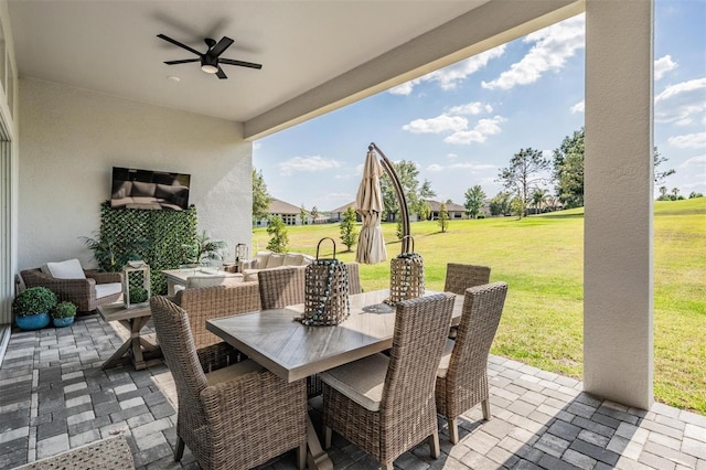 view of patio with an outdoor living space, ceiling fan, and outdoor dining space