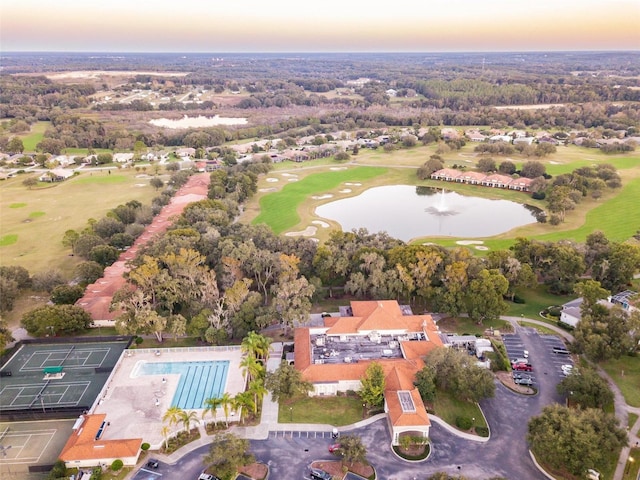 aerial view featuring a water view and view of golf course