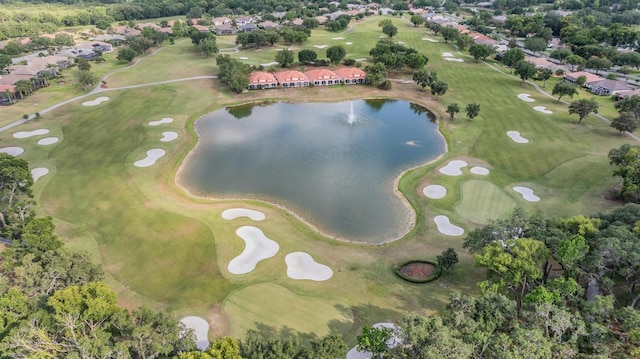 drone / aerial view featuring a water view, a residential view, and view of golf course