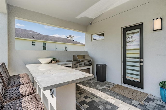 view of patio / terrace with exterior kitchen and area for grilling