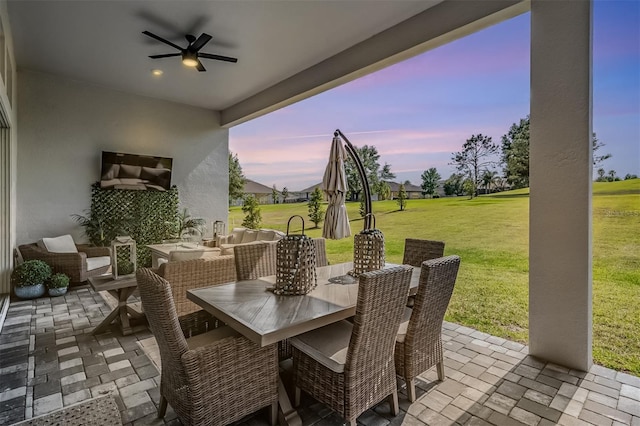 view of patio with an outdoor living space, a ceiling fan, and outdoor dining space