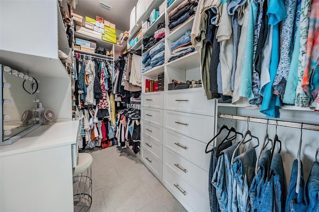 spacious closet featuring light tile patterned flooring and visible vents