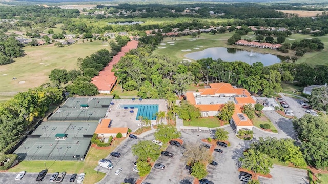 bird's eye view with a water view and golf course view