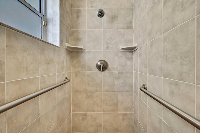 full bath featuring tiled shower