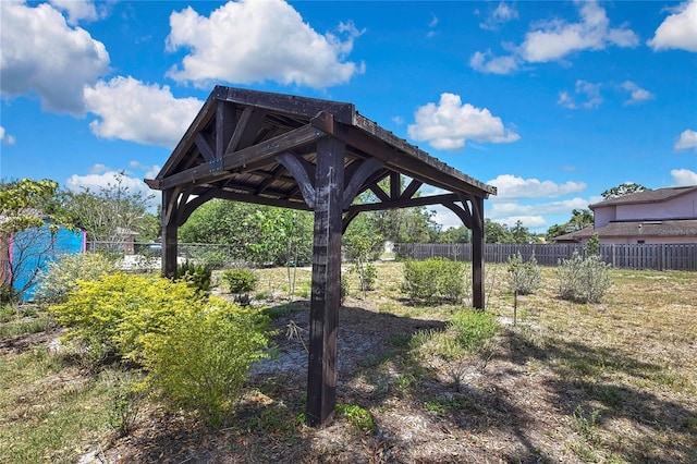 view of yard with fence and a gazebo
