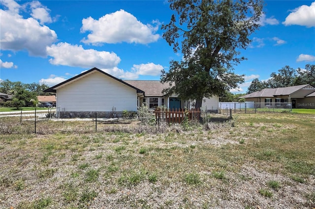 rear view of property with fence