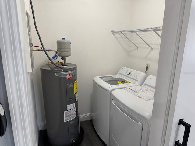 2205 N Grady Ave, Tampa, FL 33607 - clothes washing area with laundry area, dark wood finished floors, washing machine and dryer, and electric water heater