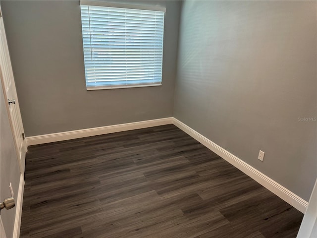 2205 N Grady Ave, Tampa, FL 33607 - empty room featuring baseboards and dark wood-style flooring