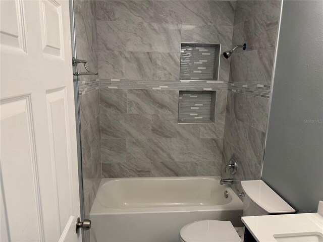 2205 N Grady Ave, Tampa, FL 33607 - full bathroom with vanity, shower / bathing tub combination, and toilet