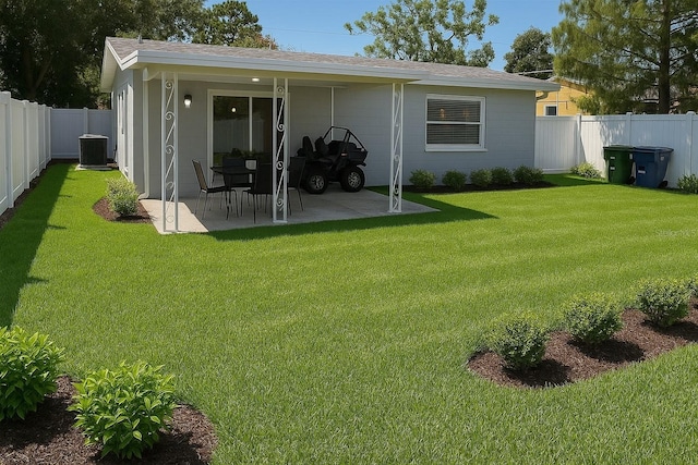 2205 N Grady Ave, Tampa, FL 33607 - rear view of property with central AC, a patio, a fenced backyard, a shingled roof, and a lawn