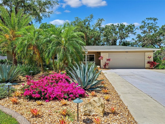 view of front of home with an attached garage and driveway
