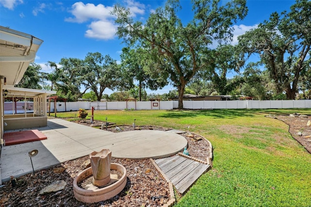 view of yard with a patio and a fenced backyard