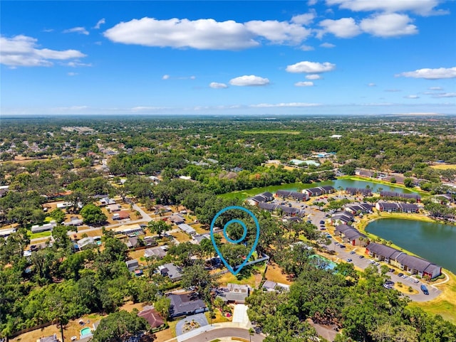 drone / aerial view with a water view and a residential view
