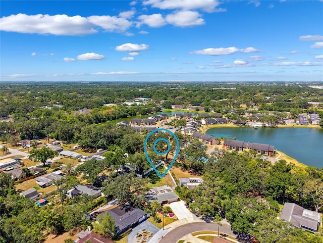 drone / aerial view featuring a water view and a residential view