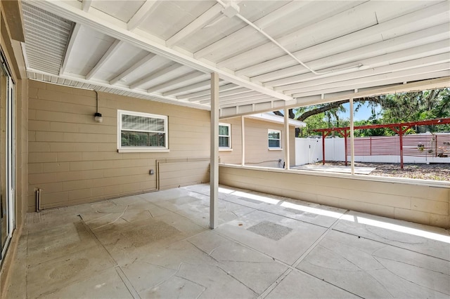 view of patio featuring fence