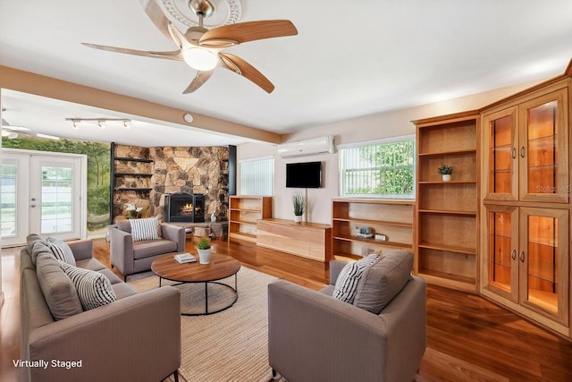 505 S Larry Cir, Brandon, FL 33511 - living area with a wall mounted air conditioner, dark wood-style floors, ceiling fan, and french doors