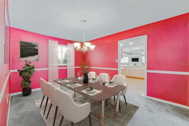 505 S Larry Cir, Brandon, FL 33511 - dining space with a chandelier, carpet flooring, and baseboards