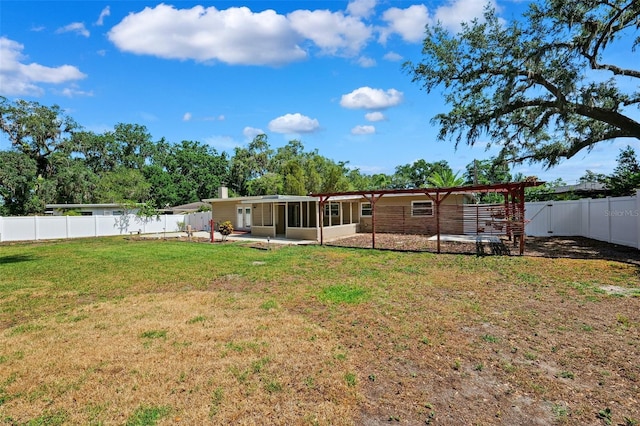 505 S Larry Cir, Brandon, FL 33511 - rear view of property with a fenced backyard and a sunroom