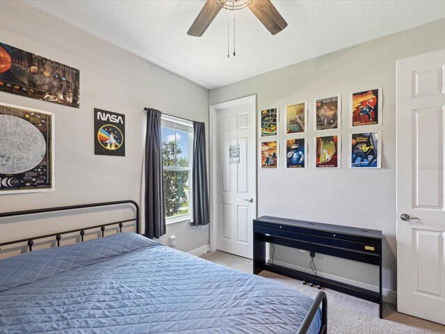 bedroom with carpet floors, a ceiling fan, and baseboards