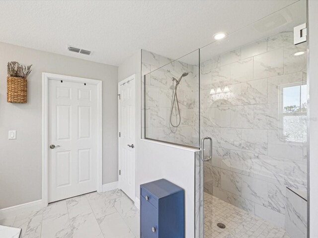 full bathroom with visible vents, baseboards, marble finish floor, and a stall shower