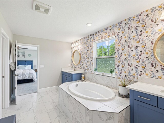 full bath featuring a sink, wallpapered walls, a bath, and visible vents