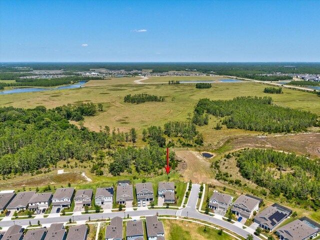 aerial view featuring a water view and a residential view