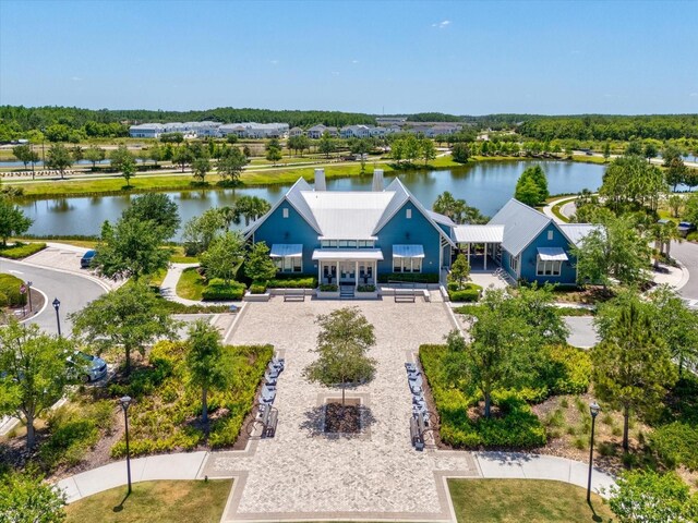 birds eye view of property with a water view