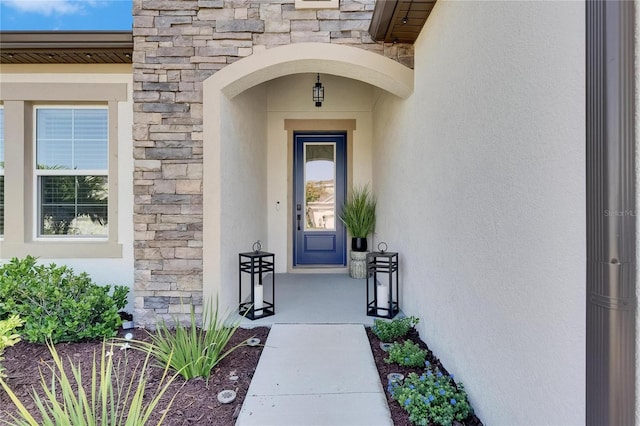 6252 Hidden Branch Dr, Apollo Beach, FL 33572 - entrance to property featuring stone siding and stucco siding
