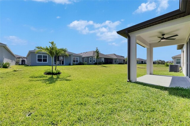 6252 Hidden Branch Dr, Apollo Beach, FL 33572 - view of yard with a residential view, ceiling fan, cooling unit, and a patio area
