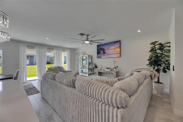 6252 Hidden Branch Dr, Apollo Beach, FL 33572 - living area featuring baseboards, ceiling fan with notable chandelier, recessed lighting, and visible vents