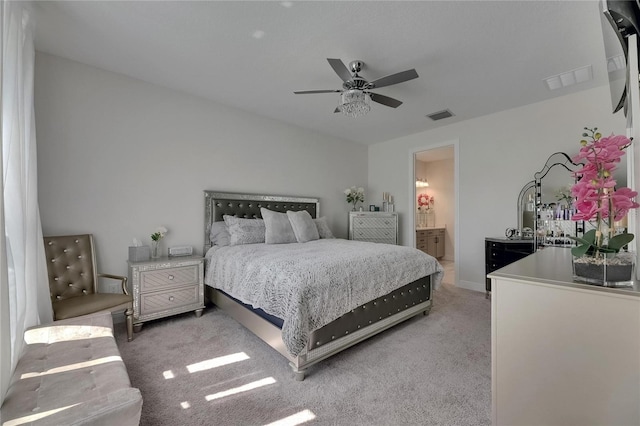 6252 Hidden Branch Dr, Apollo Beach, FL 33572 - bedroom featuring visible vents, a ceiling fan, ensuite bathroom, and light colored carpet
