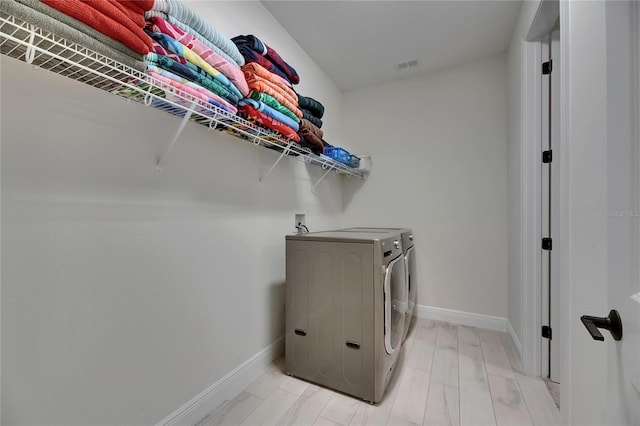 6252 Hidden Branch Dr, Apollo Beach, FL 33572 - laundry room with laundry area, baseboards, independent washer and dryer, and visible vents